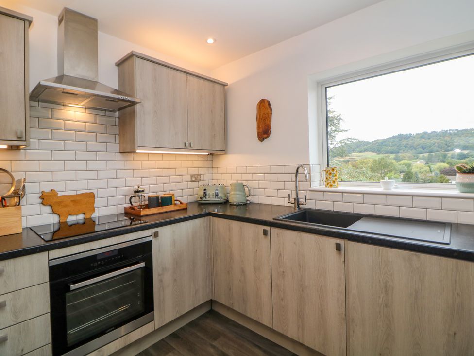 A kitchen with cabinets and appliances at Hillset View in Bakewell
