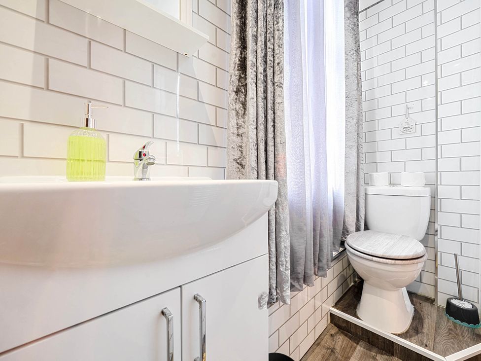 A bathroom with a sink and toilet at 