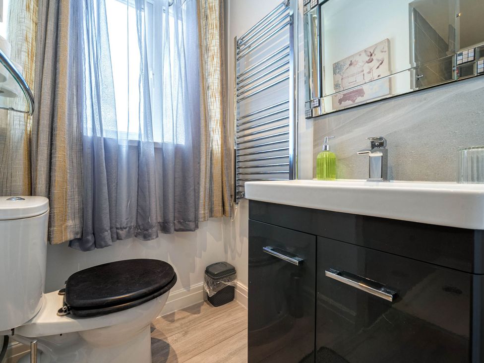 A bathroom with a toilet and sink at Ground Floor 1Bed Apartment at SeaCote, Bispham