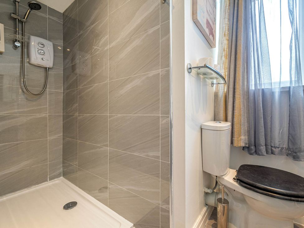 A bathroom with a shower and toilet at Ground Floor 1Bed Apartment at SeaCote in Bispham