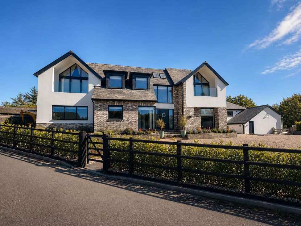 A house with large windows and a garden at Rochester Retreat Spacious 5 Bedroom House in Higham