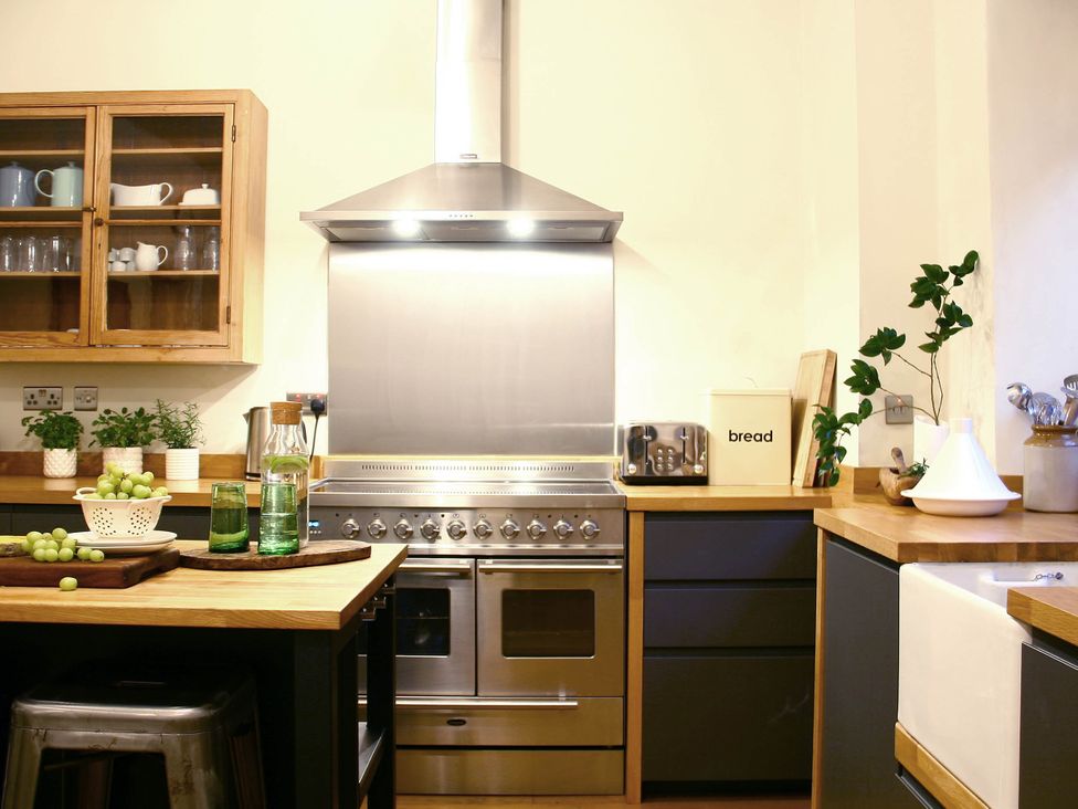A kitchen with a stove and sink at Beautiful 6Bed Sleeps 12 Stunning Views in Lynton