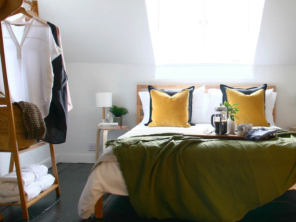 A bedroom with a bed and clothes rack at Beautiful 6Bed Sleeps 12 Stunning Views in Lynton