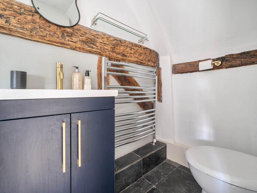 A bathroom featuring a sink and towel rail at Cottage Sleeps 4 with Enclosed Garden in Turville near Henley-On-Thames