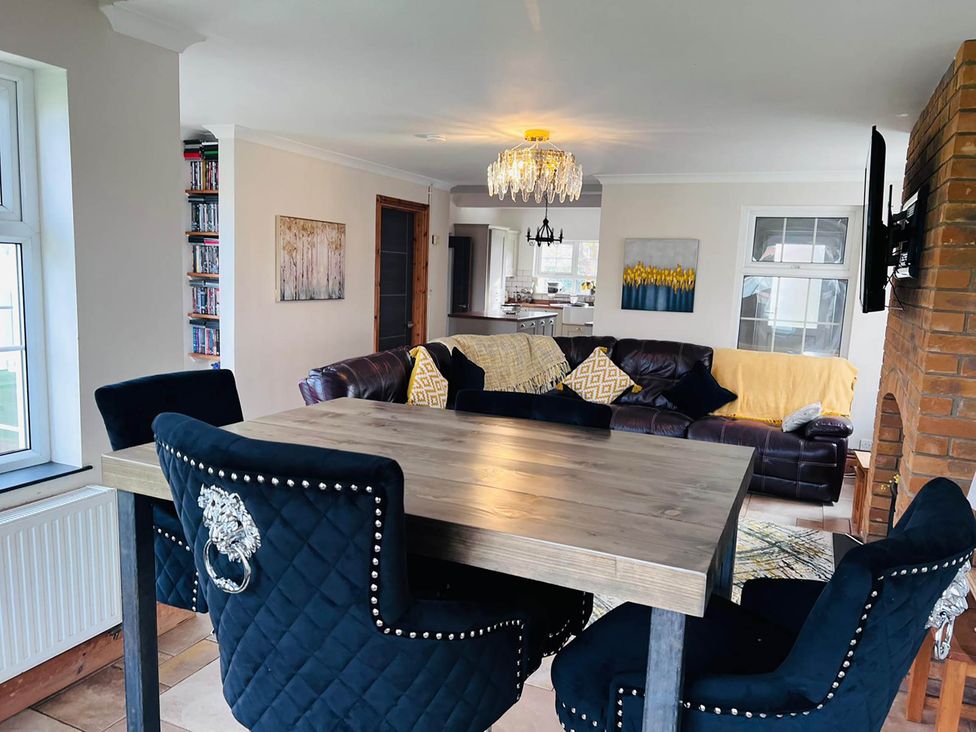 A living room with a dining area and sofa at Build your memories hot tub garden sleeps 14 Nottage