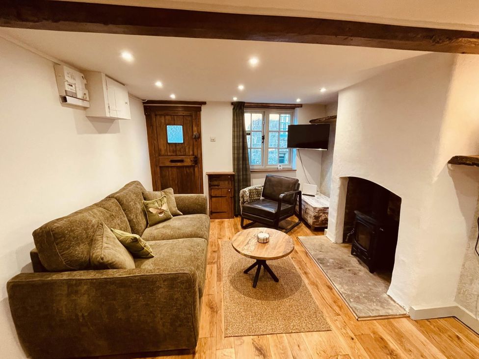 A living room with a sofa and armchair at Charming Cottage Sleeps 4 with Sauna in Shaftesbury
