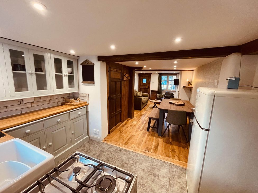 A kitchen with a sink and stove at Charming Cottage Sleeps 4 with Sauna in Shaftesbury