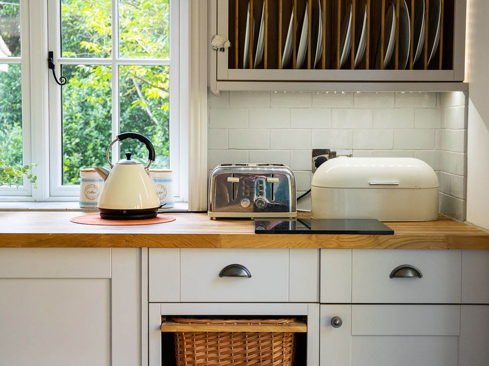 A kitchen with a kettle toaster and bread bin at 5Bed 10Guests Fireplace HotTub Pets ok Parking in Battle