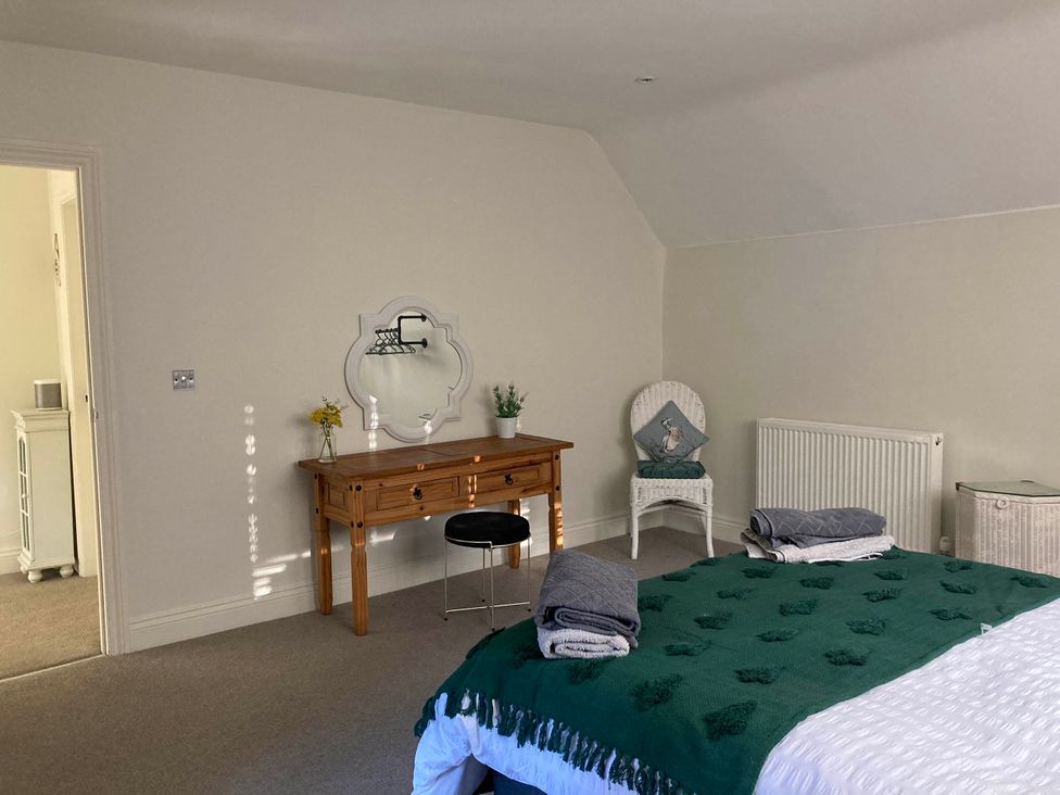 A bedroom with a bed and a desk at 5Bed 10Guests Fireplace HotTub Pets ok Parking in Battle