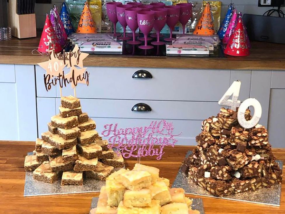 A birthday celebration setup with cakes and decorations at 5Bed 10Guests Fireplace HotTub Pets ok Parking, Battle