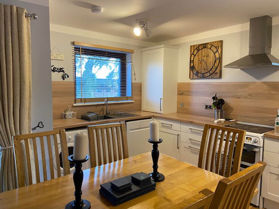 A kitchen with dining area and appliances at Blairgowrie Luxury 3 Bed Lodge with Hot Tub in Blairgowrie