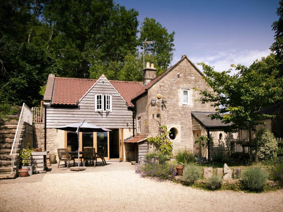 A cottage with outdoor seating and garden at Cotswolds AoNB Cottage Modern Renovation Sleeps8 near Combe Hay Lane near Bath