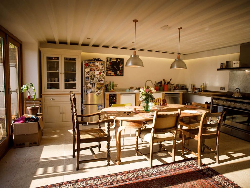 A kitchen with dining table and chairs at Cotswolds AoNB Cottage Modern Renovation Sleeps8 Combe Hay Lane near Bath
