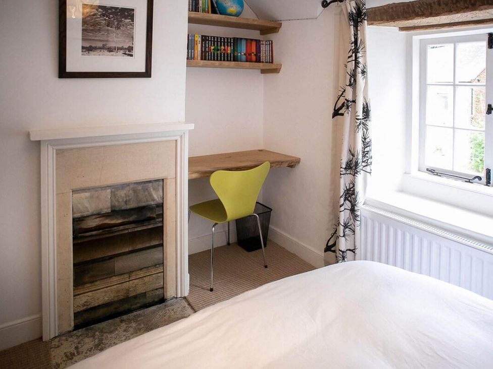A bedroom with a desk and chair at Cotswolds AoNB Cottage Modern Renovation Sleeps8 Combe Hay Lane near Bath