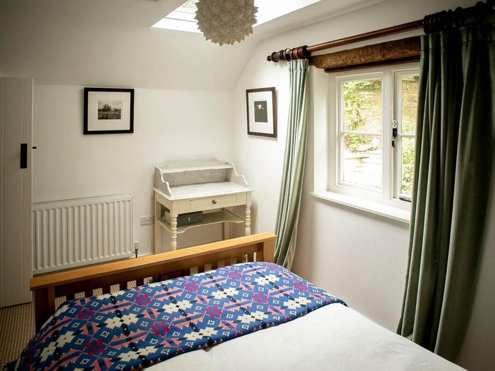 A bedroom with a bed and desk at Cotswolds AoNB Cottage Modern Renovation Sleeps8, Combe Hay Lane near Bath