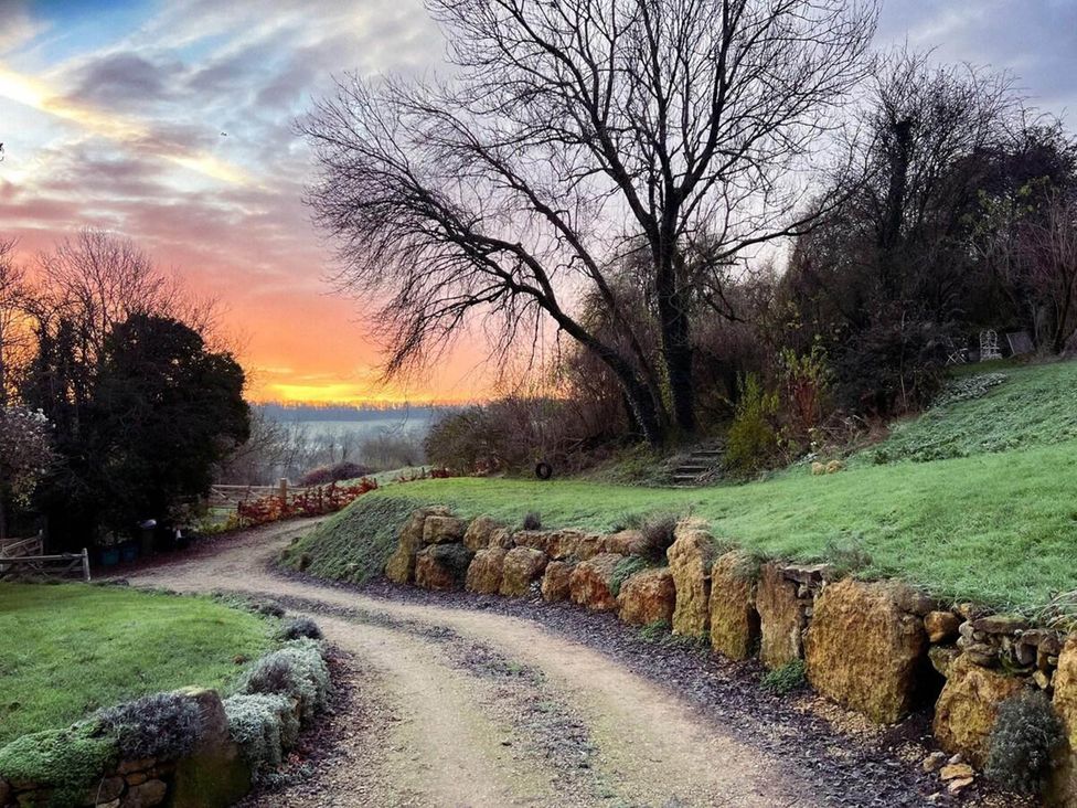 A pathway surrounded by trees and grass at Cotswolds AoNB Cottage Modern Renovation Sleeps8, Combe Hay Lane near Bath
