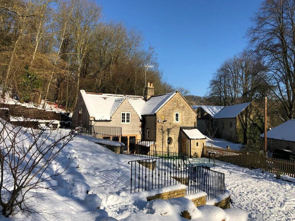 A house surrounded by snow and trees at Cotswolds AoNB Cottage Modern Renovation Sleeps8 Combe Hay Lane near Bath