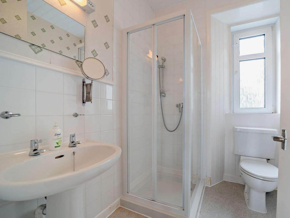 A bathroom with a sink, toilet, and shower at Dunoon Sleeps 17 Group Retreat with Parking in Kirn near Dunoon