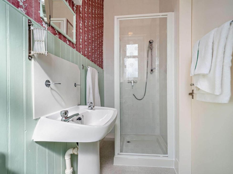 A bathroom with a sink and shower at Dunoon Sleeps 17 Group Retreat with Parking near Kirn