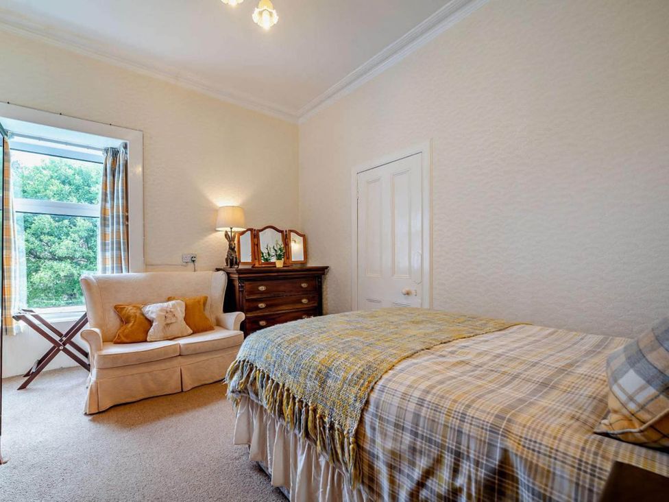A bedroom with a bed and a dresser at Dunoon Sleeps 17 Group Retreat with Parking Kirn near Dunoon