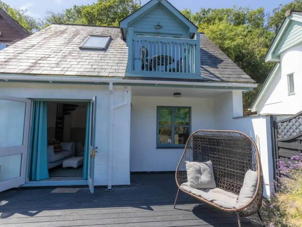 An outdoor area with a balcony and seating at 2 Bedrooms overlooking Little Petherick Creek Little Petherick