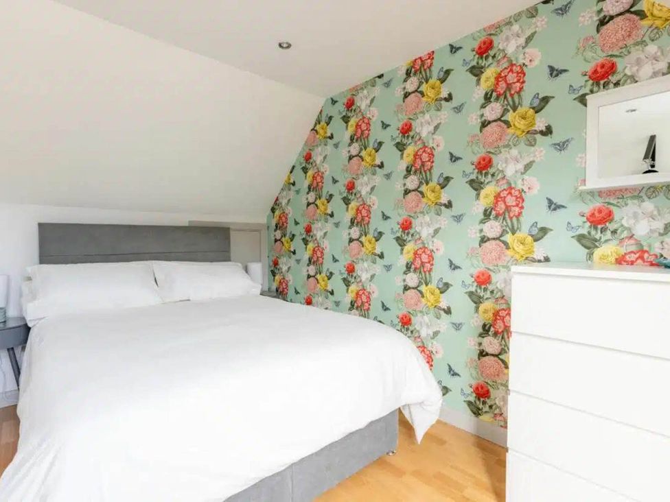 A bedroom with a bed and a dresser at 2 Bedrooms overlooking Little Petherick Creek Little Petherick
