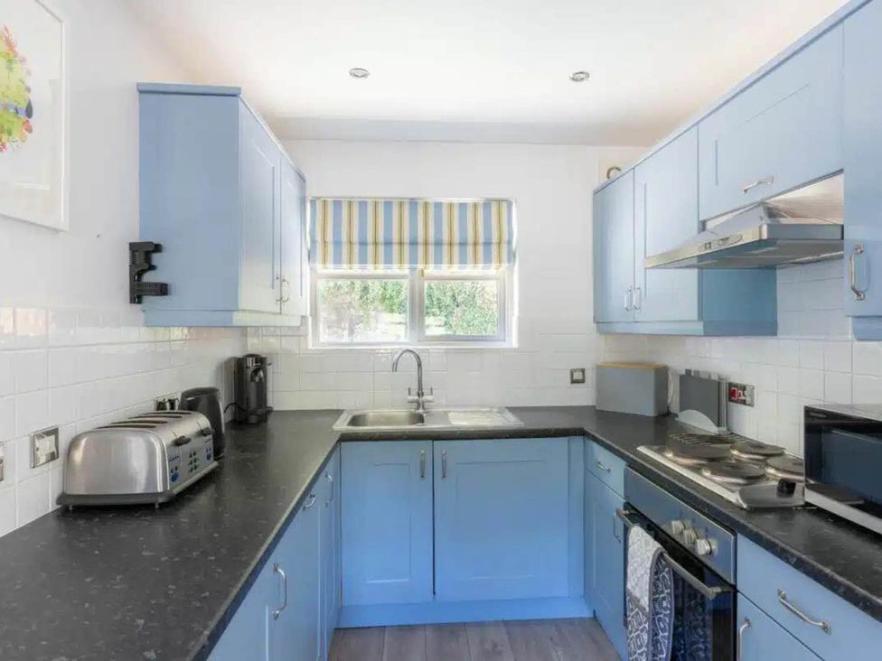 A kitchen with cabinets and appliances at 2 Bedrooms overlooking Little Petherick Creek Little Petherick