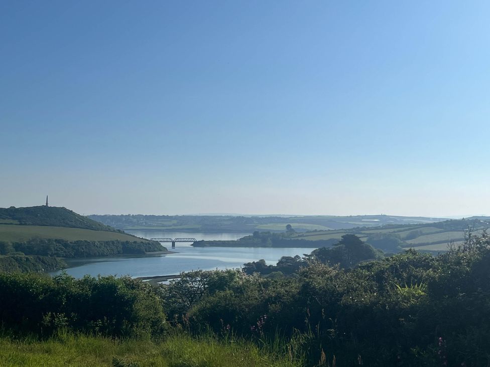 A view of a river and bridge surrounded by hills at 2 Bedrooms overlooking Little Petherick Creek Little Petherick