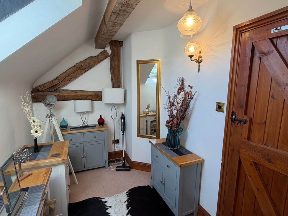 A hallway with cabinets and decorative items at 