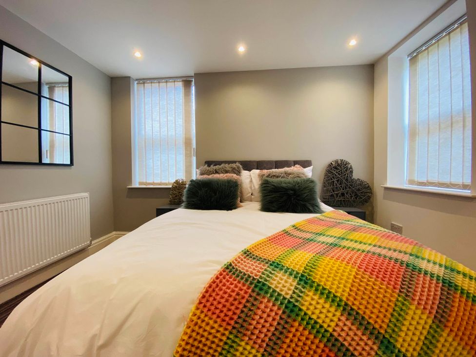 A bedroom with a bed and pillows at Blackpool 4 Beds Sleeps 10 Pet Friendly in Blackpool