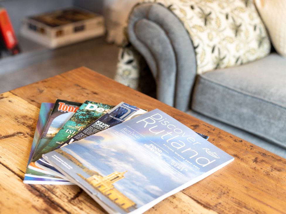 A collection of magazines on a coffee table at Cozy Nook boutique Cottage in Oakham
