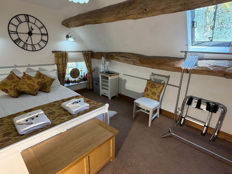 A bedroom with a bed and storage unit at Farmhouse Sleeps 5 Near Alton Towers Peak District, Cheadle