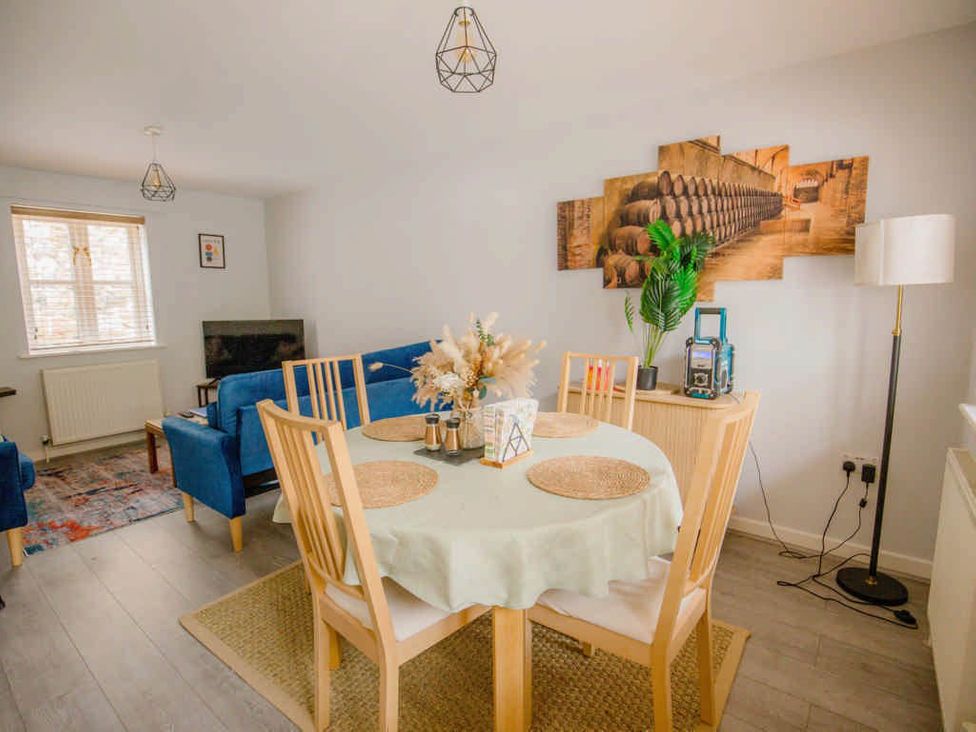A dining room with a table and chairs at House Sleeps 4 with Parking and Garden in Glastonbury