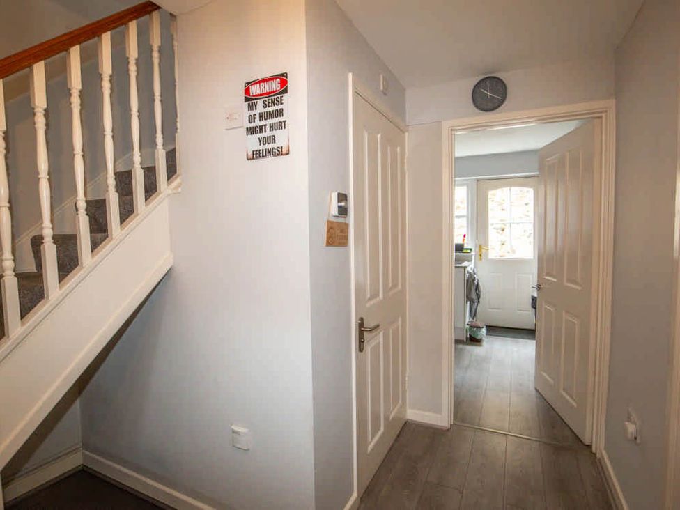 A hallway with stairs and doors at House Sleeps 4 with Parking and Garden Glastonbury