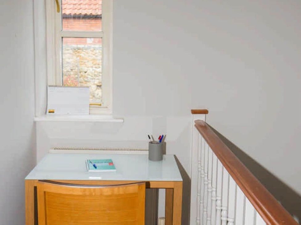 A home office area with a desk and window at House Sleeps 4 with Parking and Garden in Glastonbury