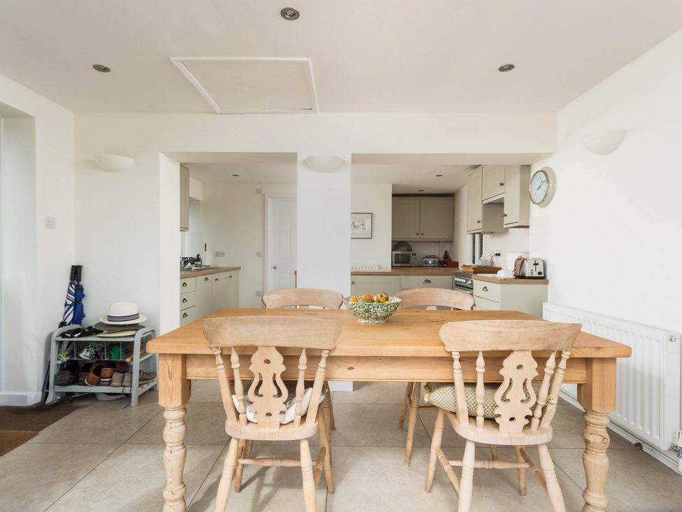 A kitchen with a table and chairs at Stunning 3 Bedroom Cottage near Historic York Ampleforth