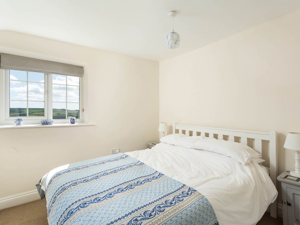 A bedroom with a bed and window at Stunning 3 Bedroom Cottage near Historic York Ampleforth