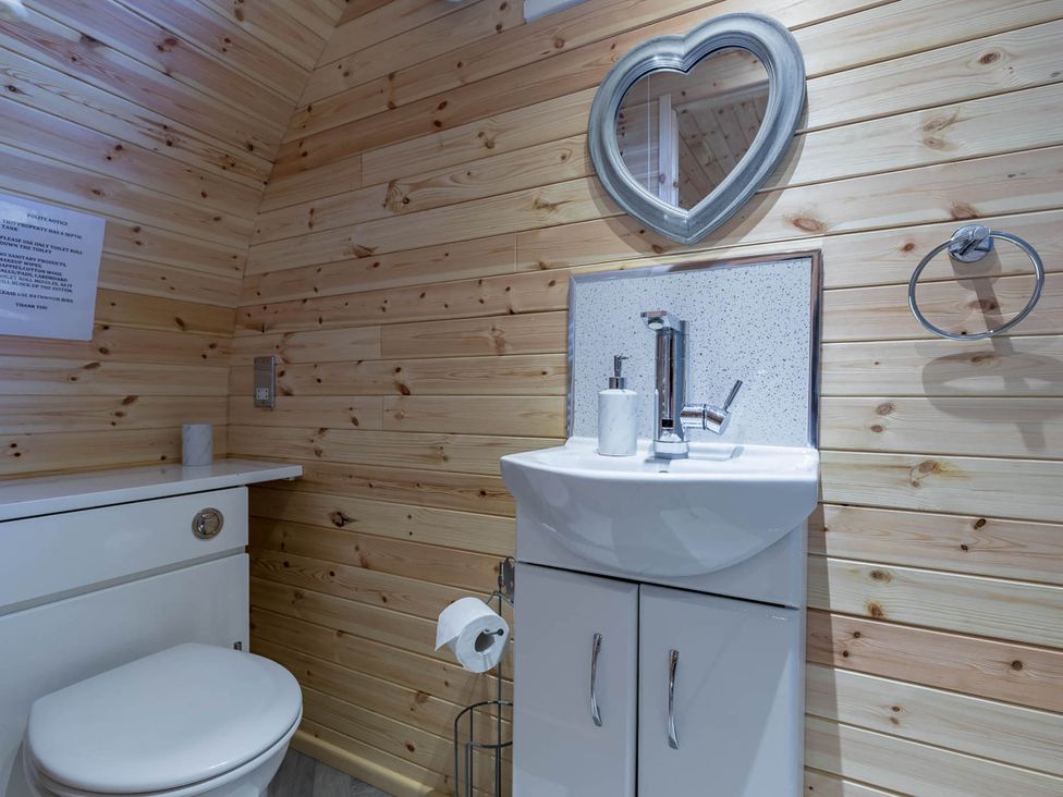 A bathroom with a sink and toilet at The Lodge at Brambles Farm Sleeps 4 Hot Tub in Leek