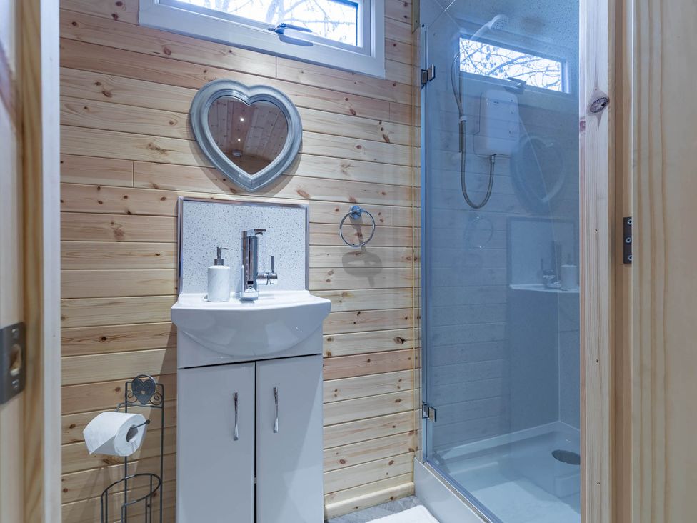 A bathroom with a sink and shower at The Lodge at Brambles Farm Sleeps 4 Hot Tub Leek