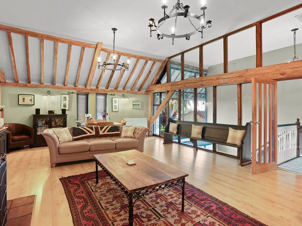 A living room with a sofa, coffee table, and rug at 1880s Barn Conversion Sleeps4 Pet Friendly, Hereford