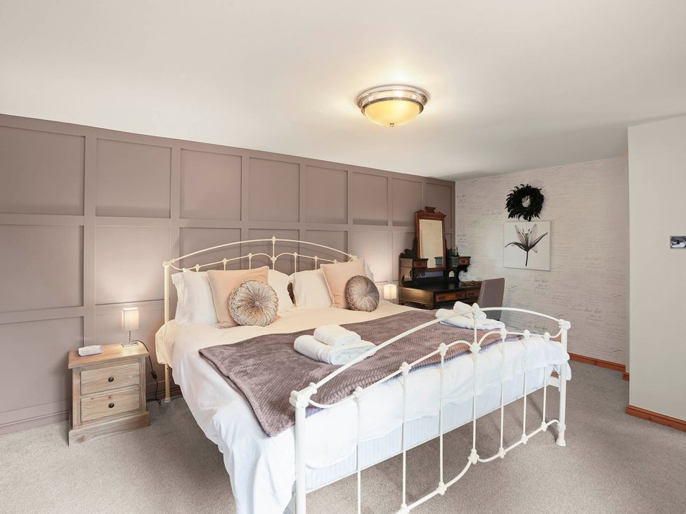 A bedroom with a bed and nightstand at 1880s Barn Conversion Sleeps4 Pet Friendly in Hereford