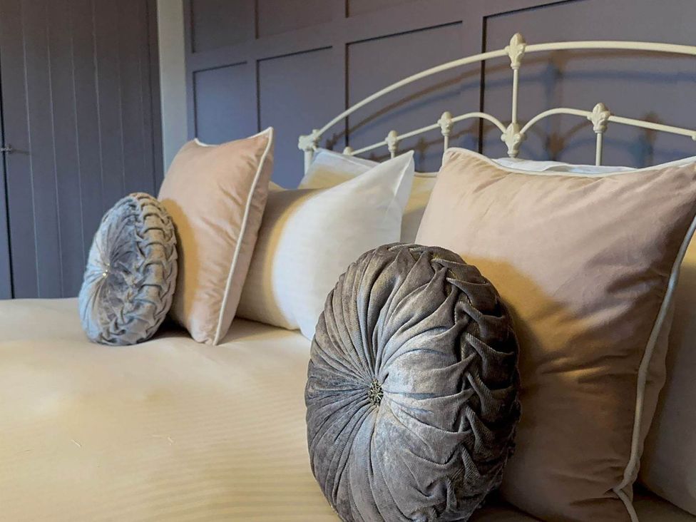 Bed with decorative pillows at 1880s Barn Conversion Sleeps4 Pet Friendly Hereford