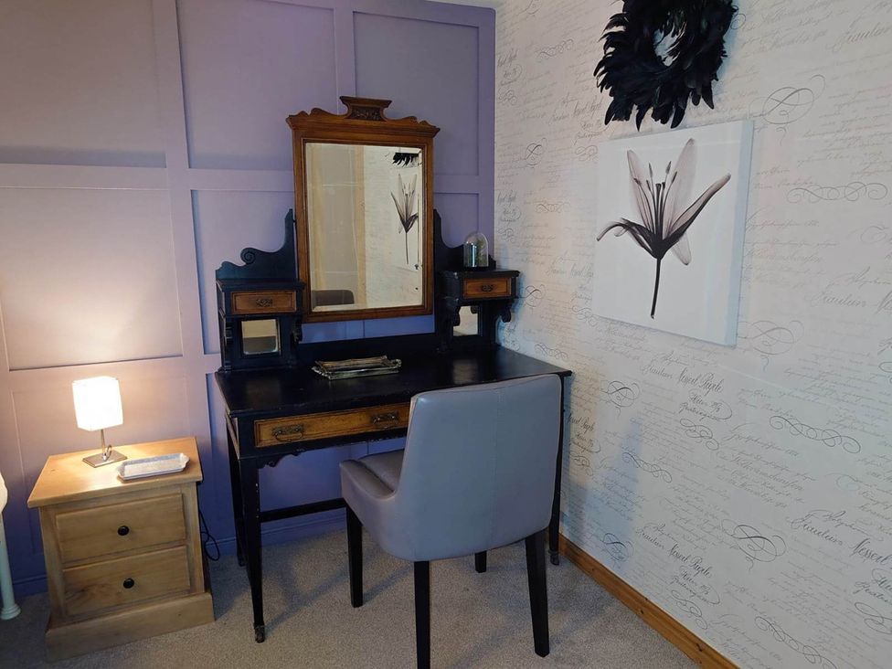 A bedroom with a desk and mirror at 1880s Barn Conversion Sleeps4 Pet Friendly in Hereford