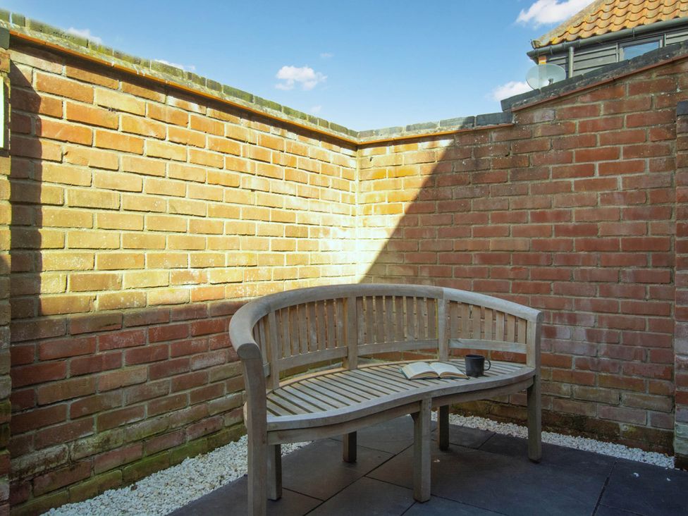 A seating area with a bench and book at 1880s Barn Conversion Sleeps4 Pet Friendly Hereford