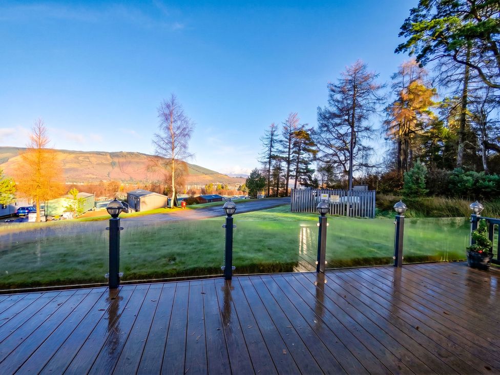 An outdoor area with decking and trees at Dunoon 3Bed Lodge Sleeps 6 Pet Friendly near Dunoon