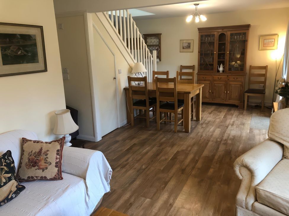 A dining room with a table and chairs at Cosy 3 Bedroom House on Cornish estate with pool St Tudy