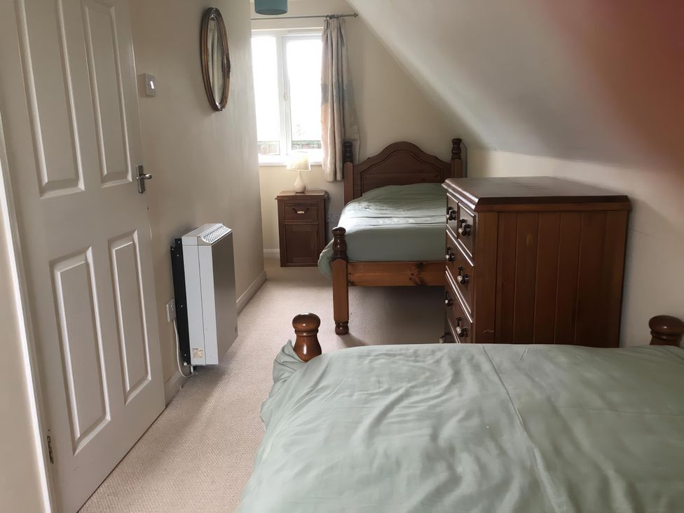 A bedroom with two beds and a dresser at Cosy 3 Bedroom House on Cornish estate with pool St Tudy
