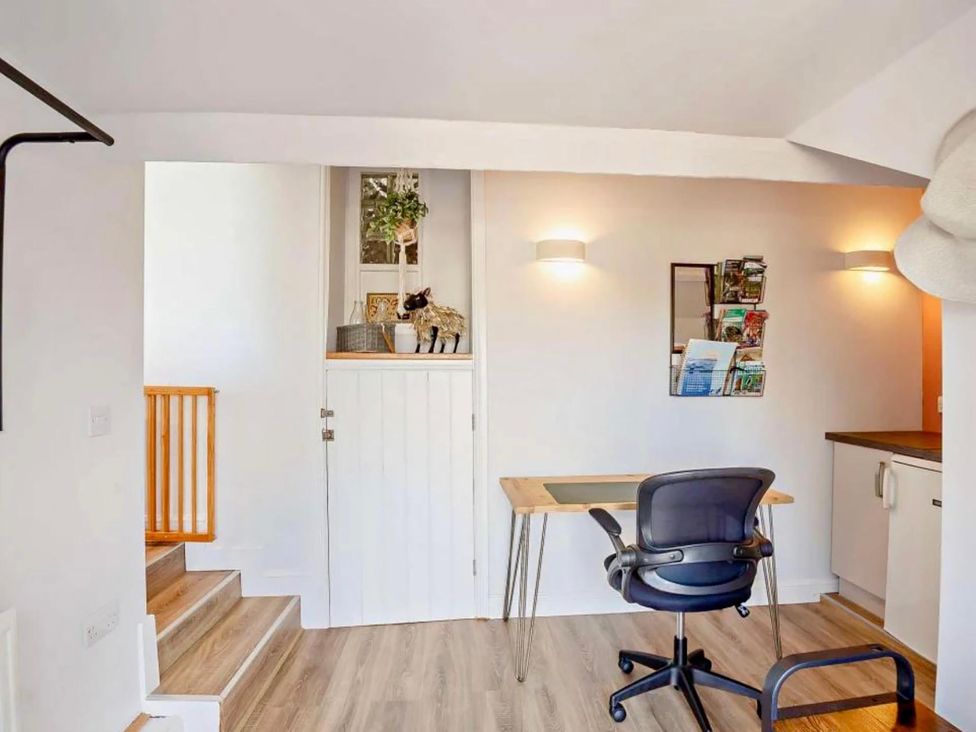 An office space with a desk and chair at Cottage Sleeps 5 with Parking and Garden in Carreglefn
