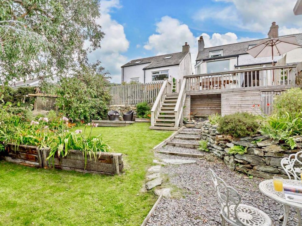 A garden with steps leading to a deck at Cottage Sleeps 5 with Parking and Garden in Carreglefn