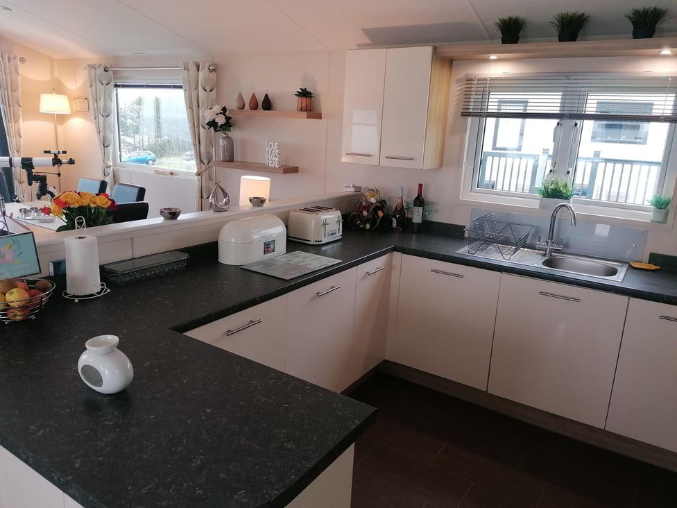 A kitchen with a sink and countertop at Seaside Lodge Retreat in Eyemouth